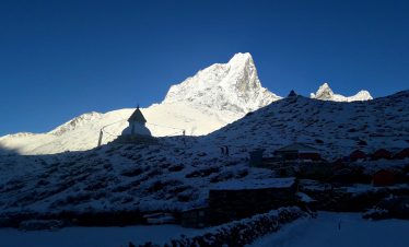 a view as seen from dingboche, in the background stands a chaitya also a small temple in the ebc trekking trail of everest region also known as khumbu region