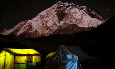 Night shot photo of mt. Nuptse touching the sky and the stars in the everest trekking region