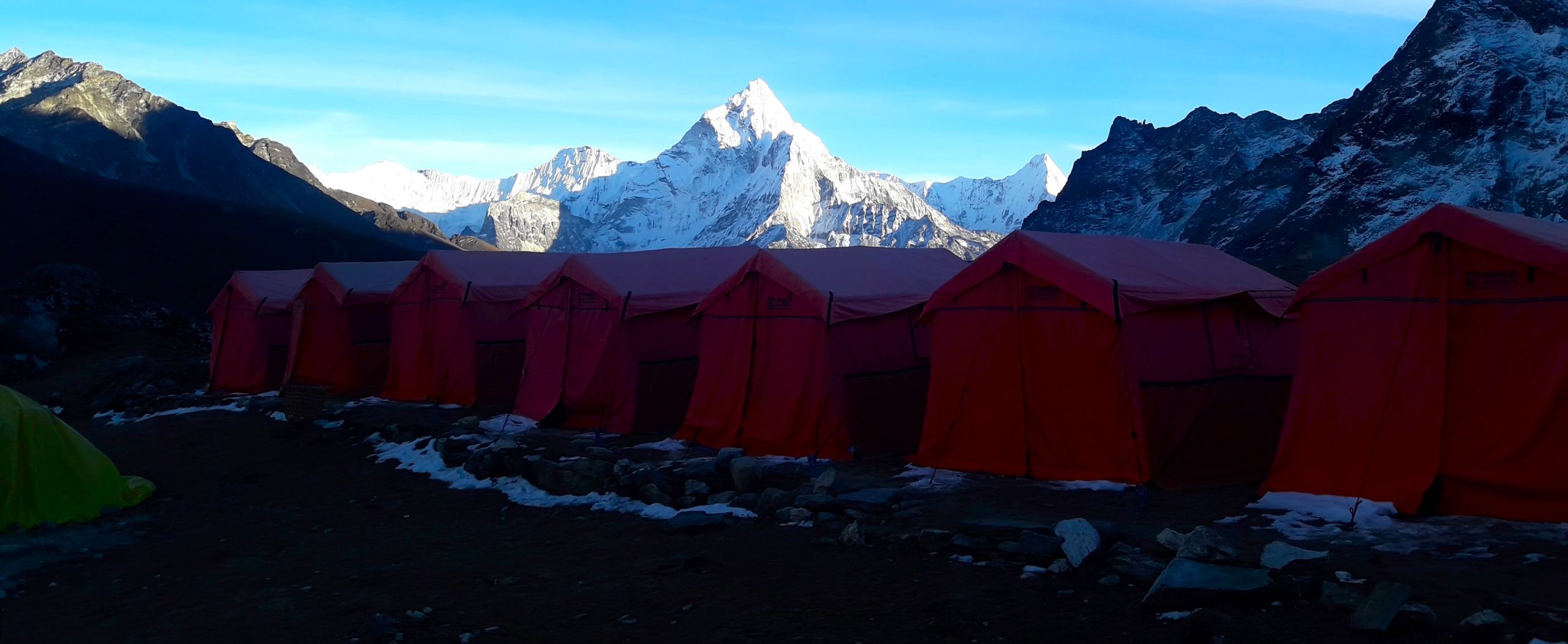series of tents set in the winter of Everest region for the campers to stay the night