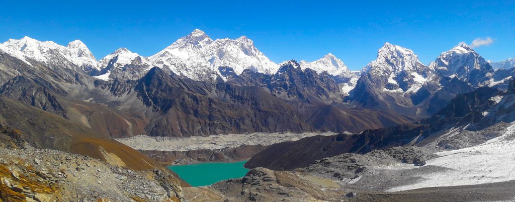 A pond among the glaciers, pass and mountains in the khumbu region of nepal for luxury, budget and standard treks of nepal.